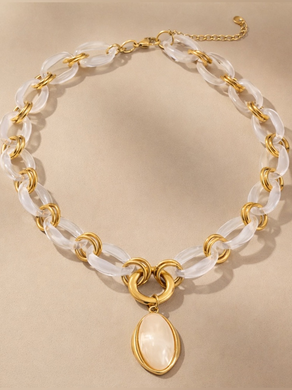 Anthropologie Clear Acrylic and Gold Link Necklace with Cream Pendant